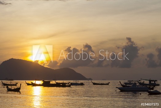 Picture of Beautiful sunrise seascape view with boat in phuket island